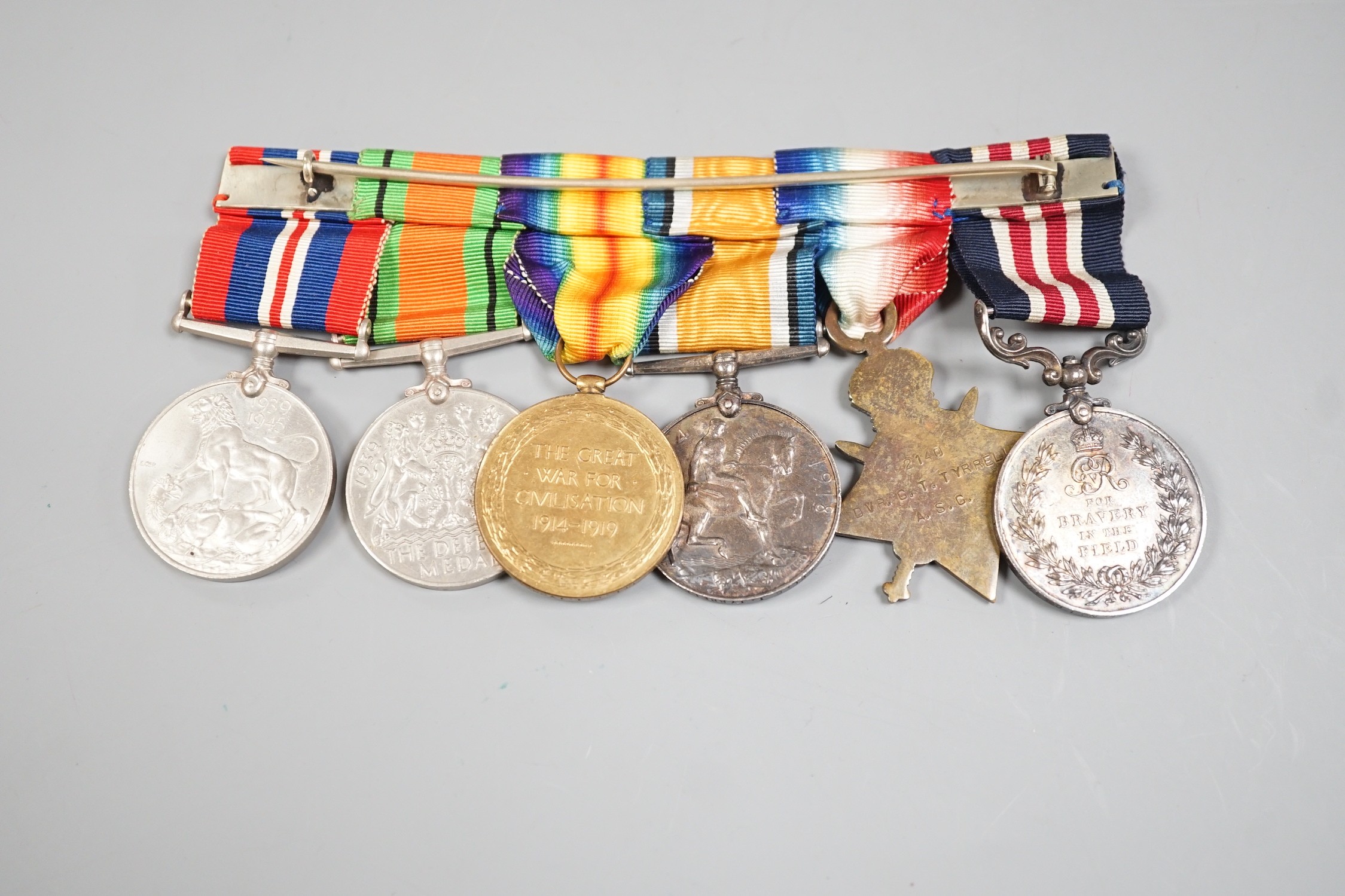 A Great War medal group of 6 including a Military Medal awarded to T4-240995 L.C PL C.T. TYRRELL. NO.I COY 47/D.T. A.S.C., a WWI trio to 2140 DVR. C. T. TYRRELL. A.S.C. and T-2140 CPL.C.T TYRRELL. A.S.C. and related mini